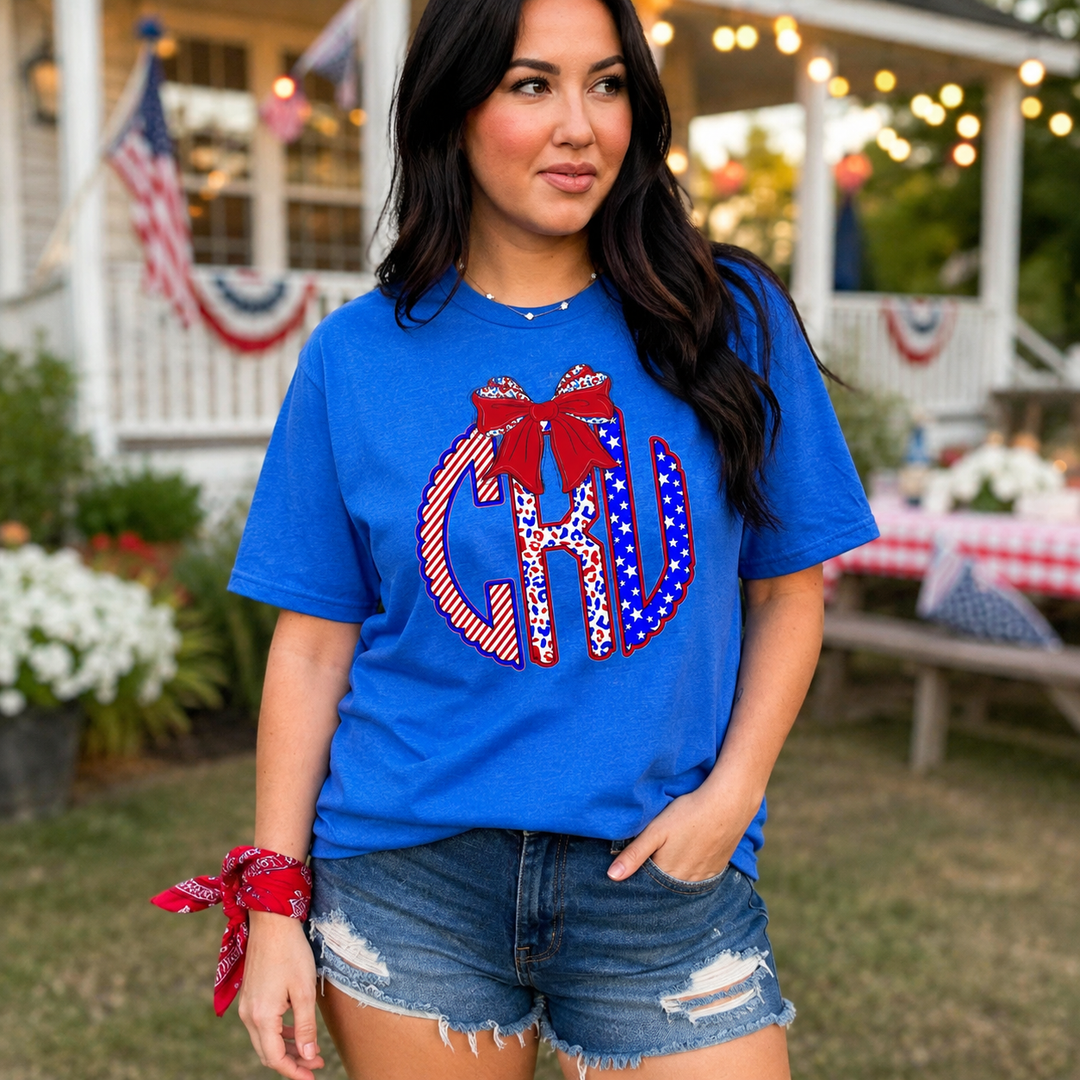 Woman wearing a blue patriotic bow graphic T-shirt at a summer porch gathering