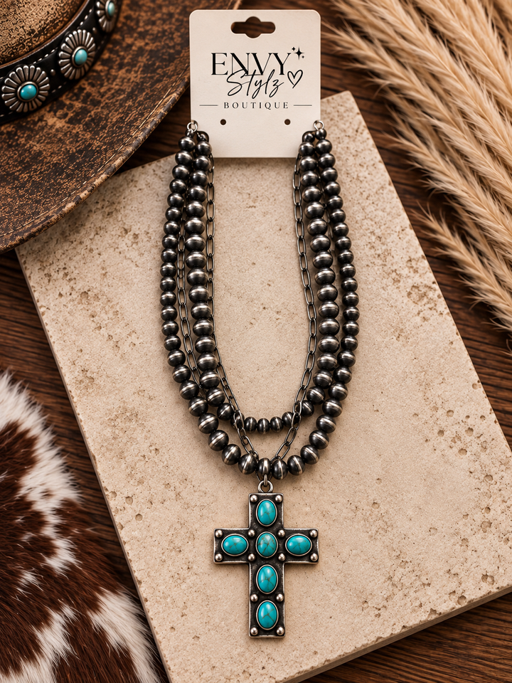 Turquoise Faith Cross Necklace with oxidized silver-tone layers, turquoise accents and statement cross pendant