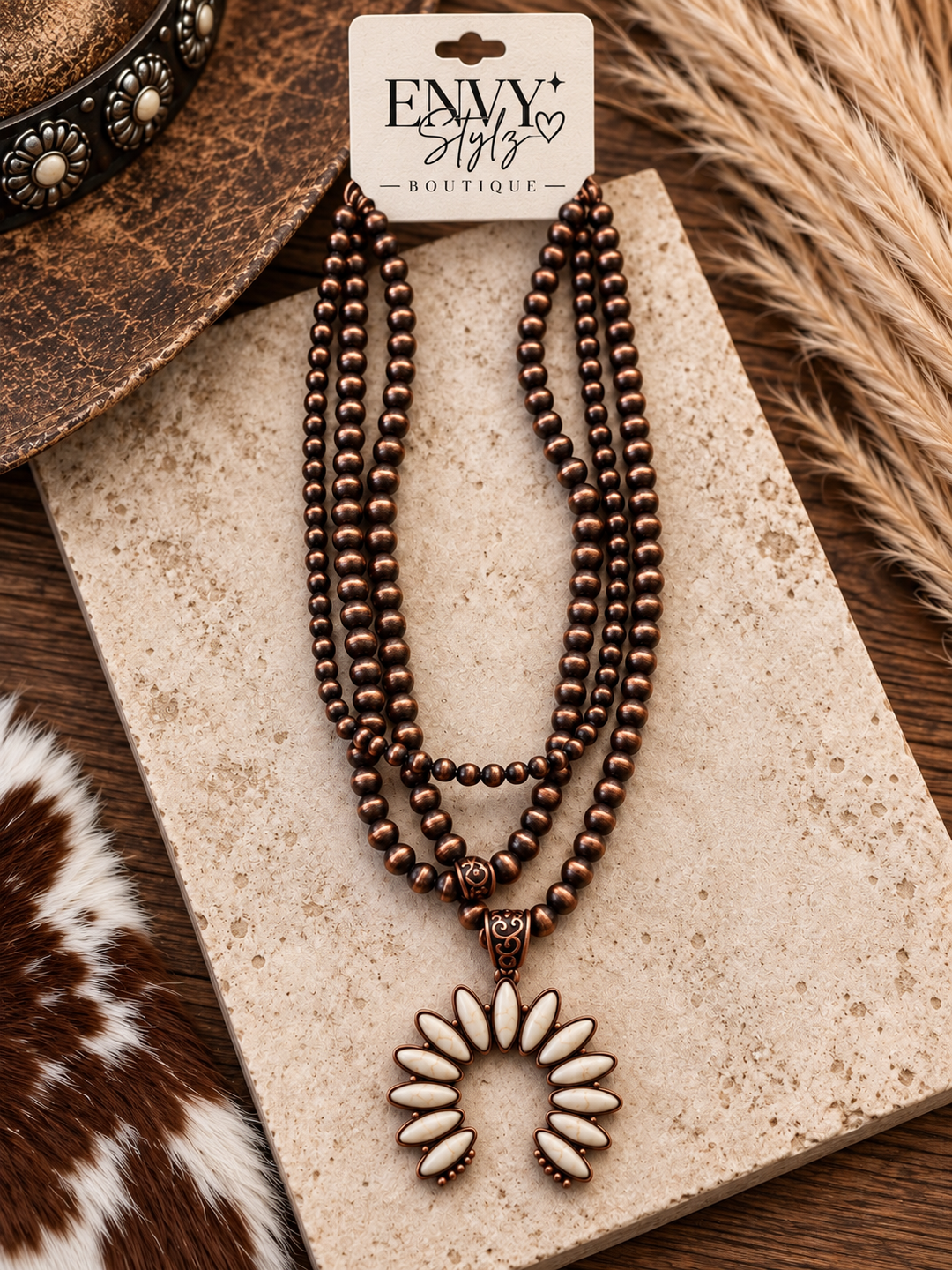 Desert Ivory Squash Blossom Necklace with antique copper-tone pearl strands and ivory pendant