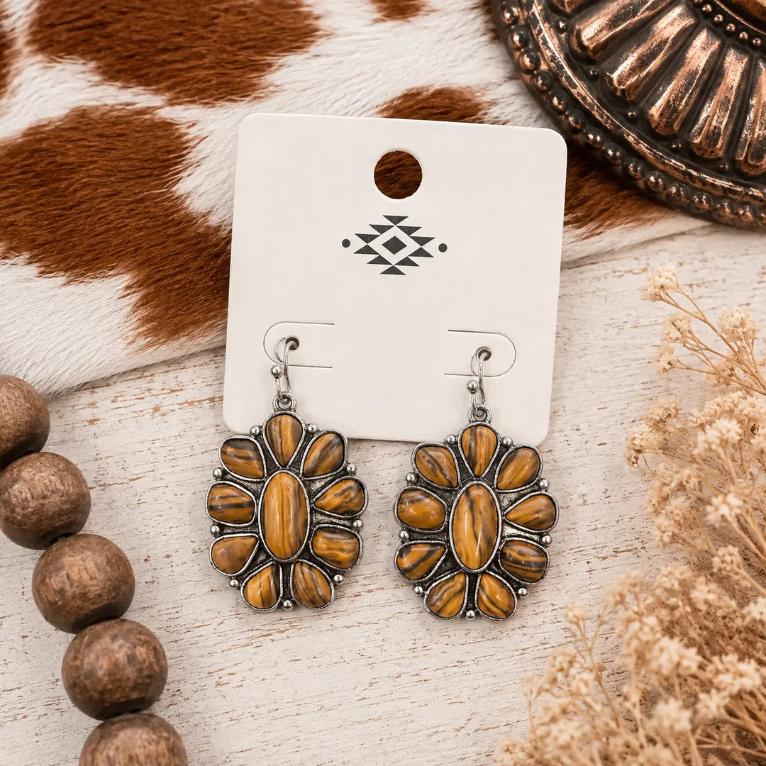 Silver-tone woodgrain concho dangle earrings with warm brown accents