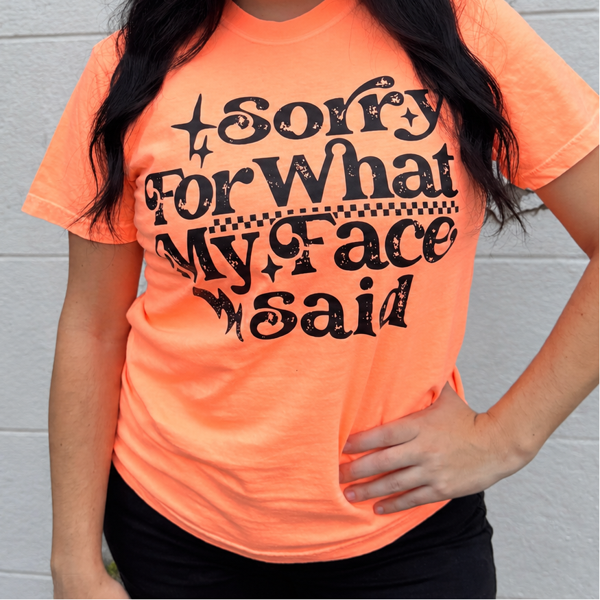 Sorry for What My Face Said neon orange graphic tee from Envy Stylz Boutique