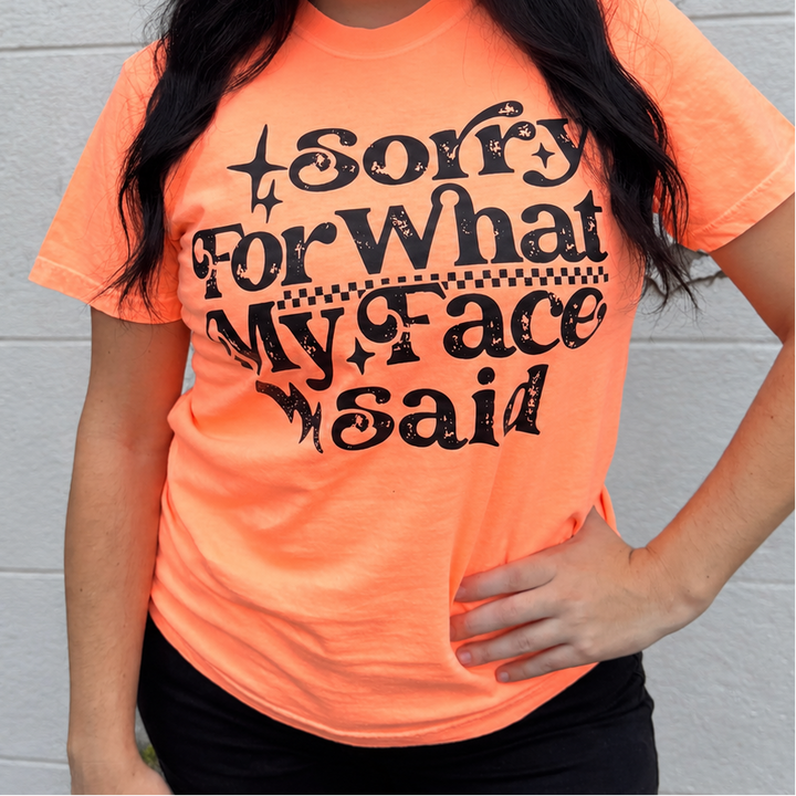 Sorry for What My Face Said neon orange graphic tee from Envy Stylz Boutique