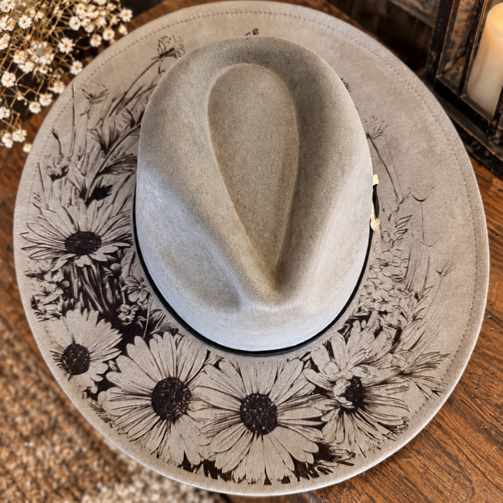 Top view of the taupe Wild Daisy wide-brim Western hat with dark daisy artwork