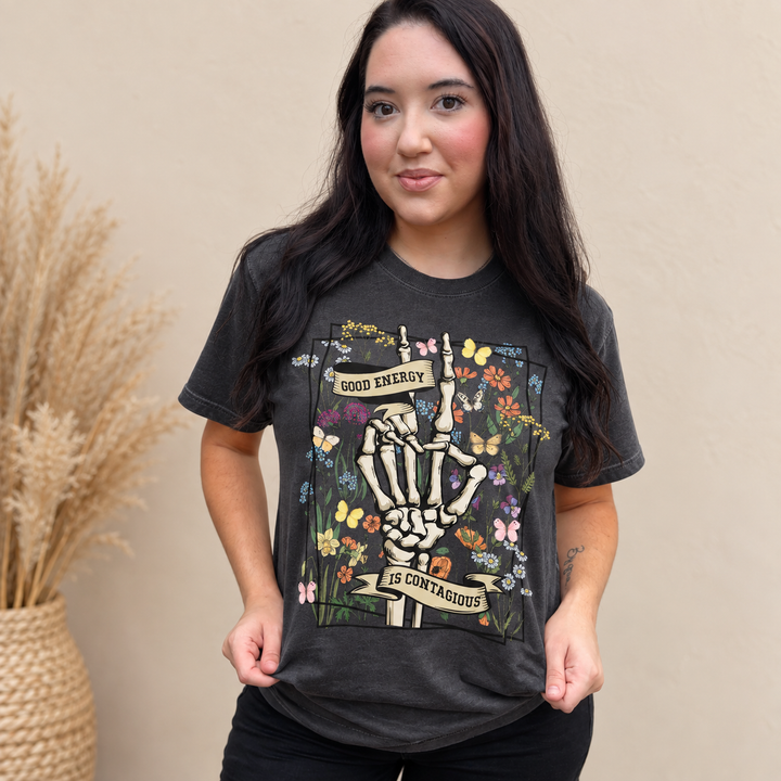 Woman wearing the Good Energy Charcoal Positive Vibes graphic tee