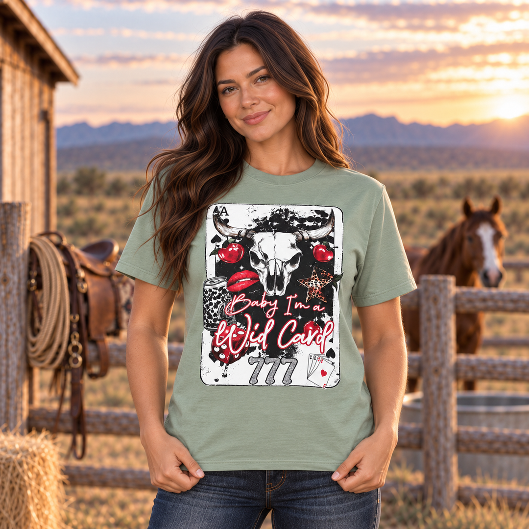 Brunette woman wearing sage Baby I’m a Wild Card Western graphic tee