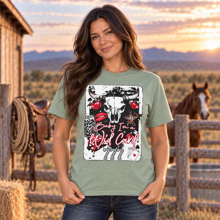 Brunette woman wearing sage Baby I’m a Wild Card Western graphic tee