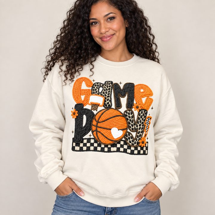 Game Day Basketball sand crewneck sweatshirt on curly-haired model, front view