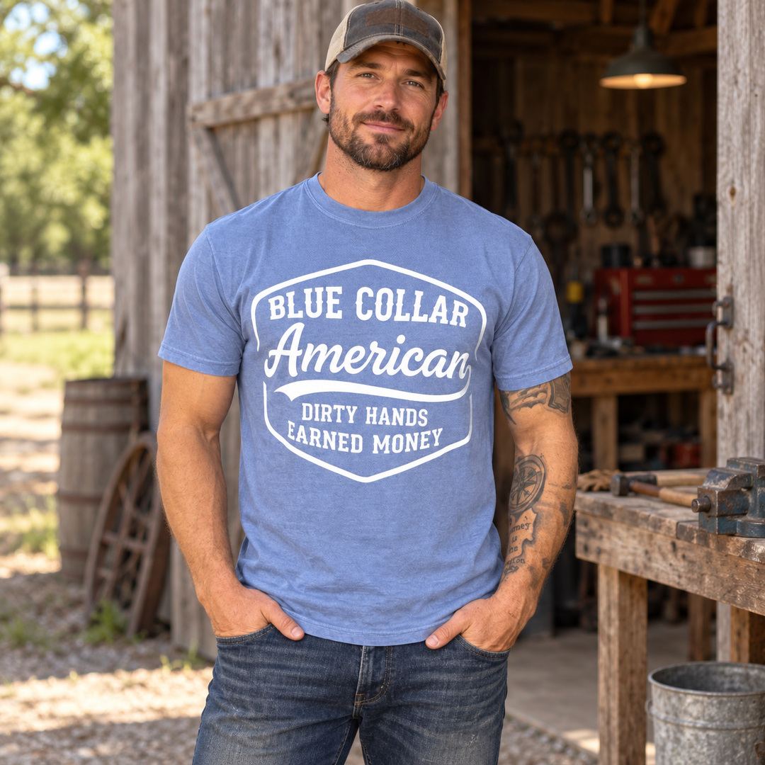 Man wearing Blue Collar American Washed Denim patriotic T-shirt in a complete-head two-thirds Southern workshop view