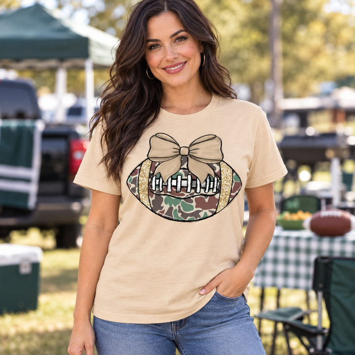 Camo Football Bow Sweet Cream game day tee on model, front view