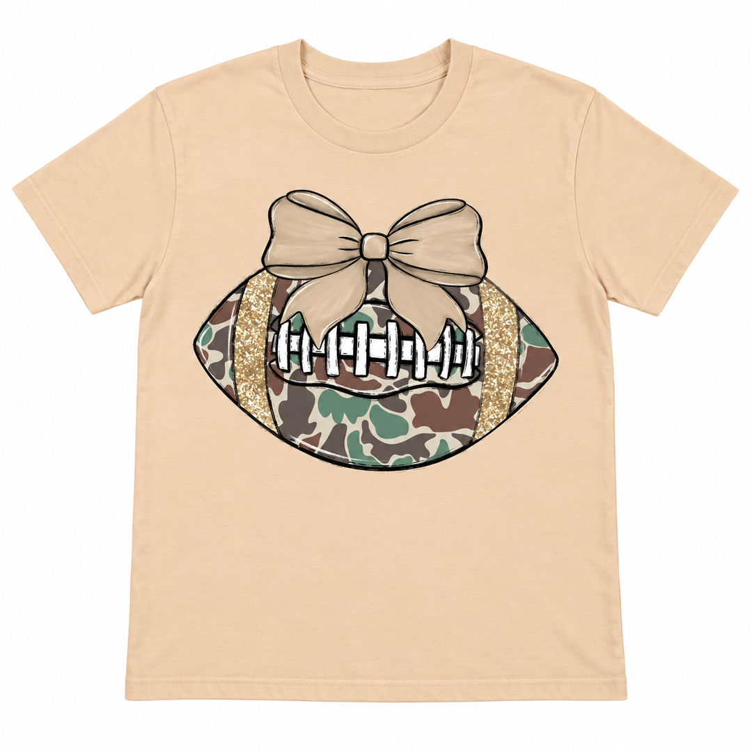 Camo Football Bow Sweet Cream game day tee, white background flat lay
