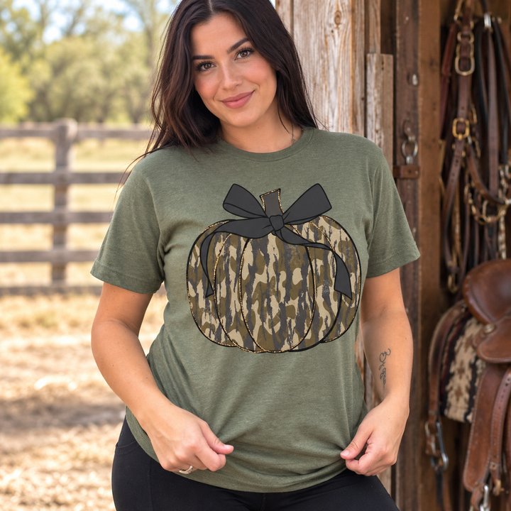 Camo Pumpkin military green graphic tee on model at a western ranch