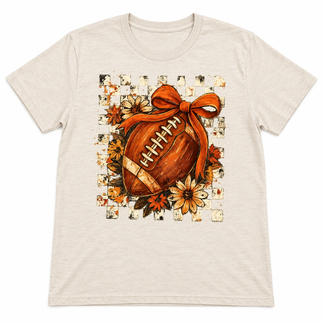 Checkered Floral Football Bow oatmeal game day tee flat lay on white