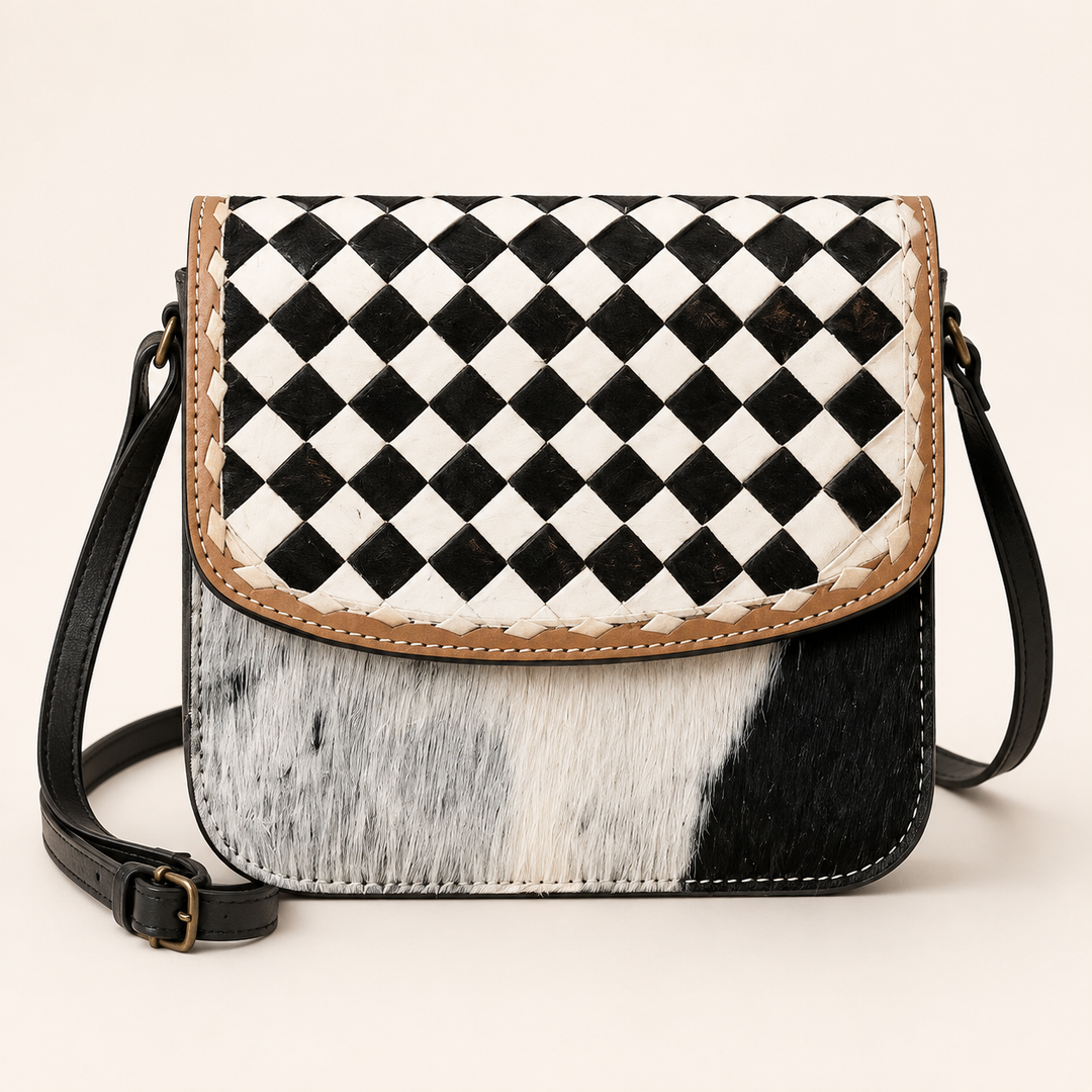 Checkmate Cowgirl cowhide crossbody bag with black-and-white checkerboard flap, front product view
