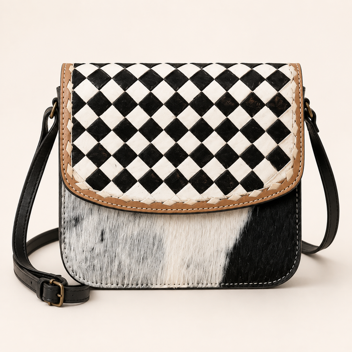 Checkmate Cowgirl cowhide crossbody bag with black-and-white checkerboard flap, front product view
