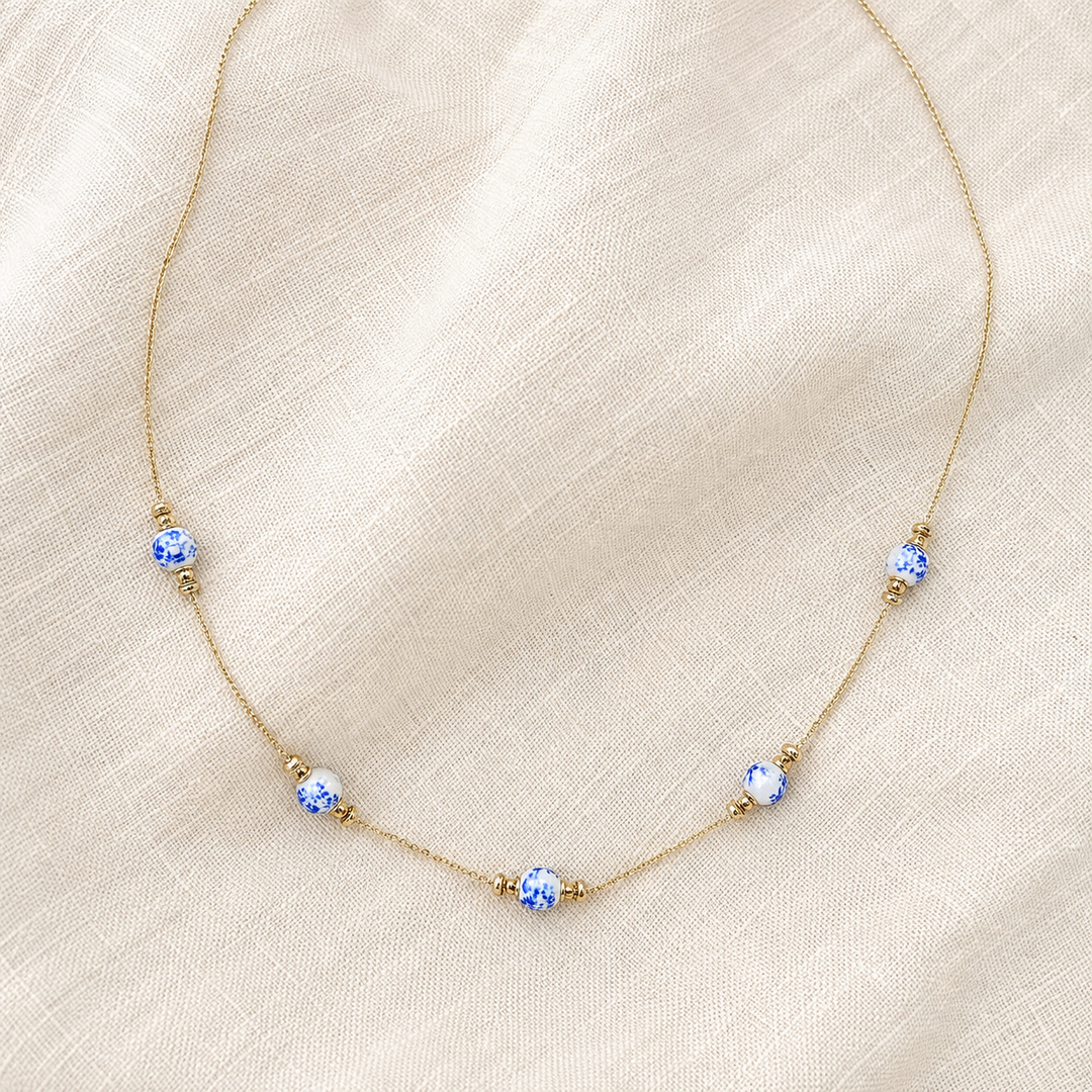 Vintage blue and white chinoiserie five-station necklace on delicate gold-tone chain, product view