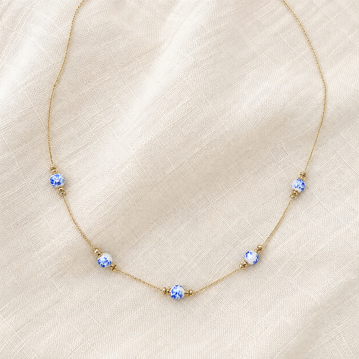 Vintage blue and white chinoiserie five-station necklace on delicate gold-tone chain, product view