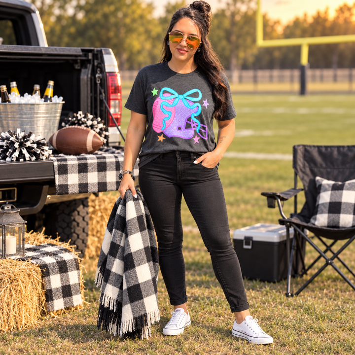 Woman wearing Colorful Football Helmet graphite graphic tee at a small-town tailgate