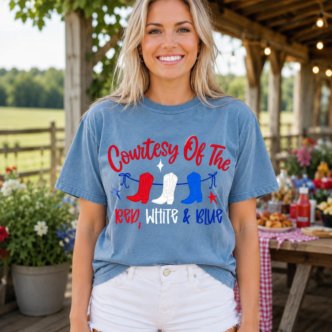 Blonde woman wearing the Courtesy of the Red, White and Blue washed denim patriotic graphic tee