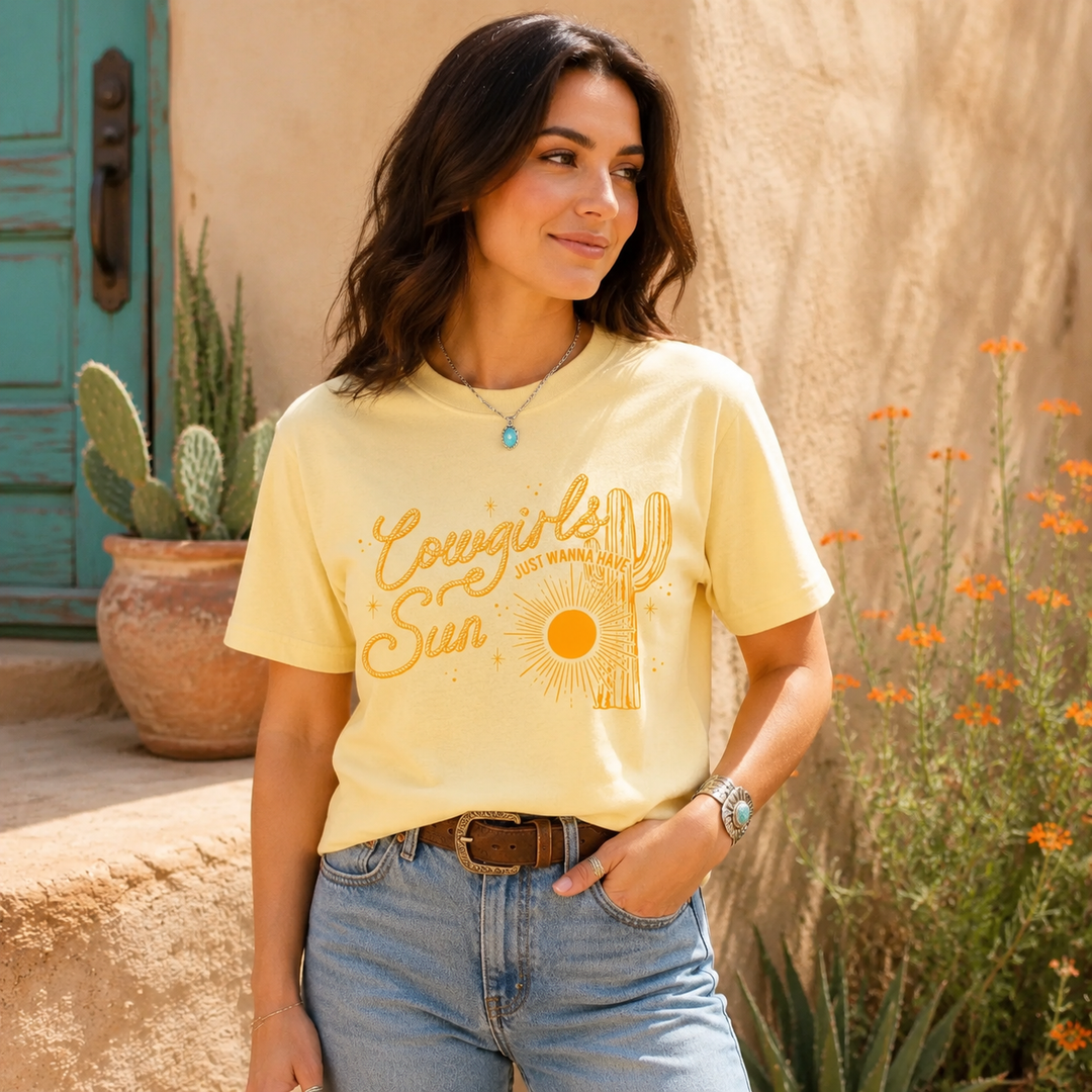 Woman wearing the Cowgirls Just Wanna Have Sun butter-yellow Western graphic tee
