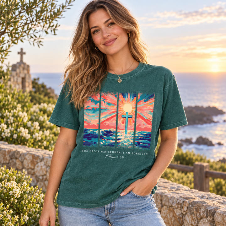 Woman wearing Cross Has Spoken Sunset Scripture Emerald graphic T-shirt