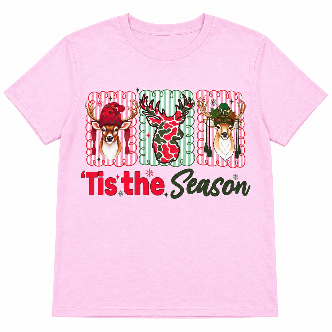 Light pink Deer Tis the Season Christmas graphic tee on a pure white background