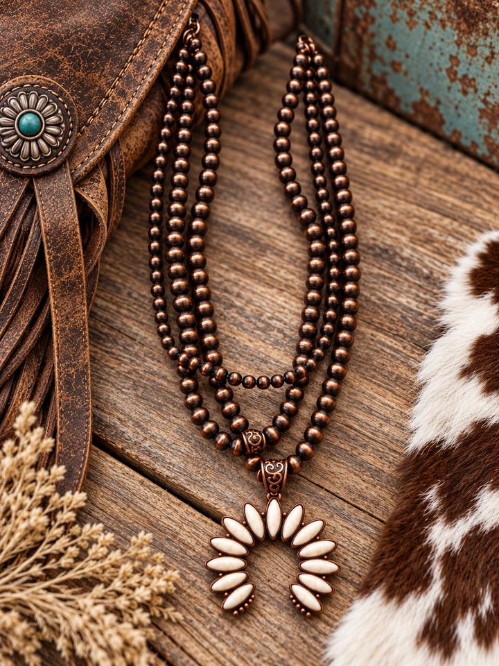 Desert Ivory Squash Blossom Necklace styled with Western leather and cowhide