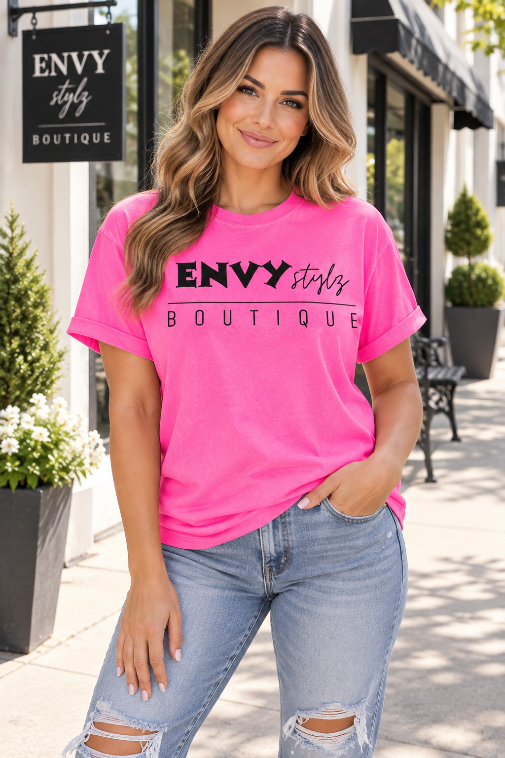 Woman wearing Envy Stylz Neon Pink boutique logo graphic T-shirt