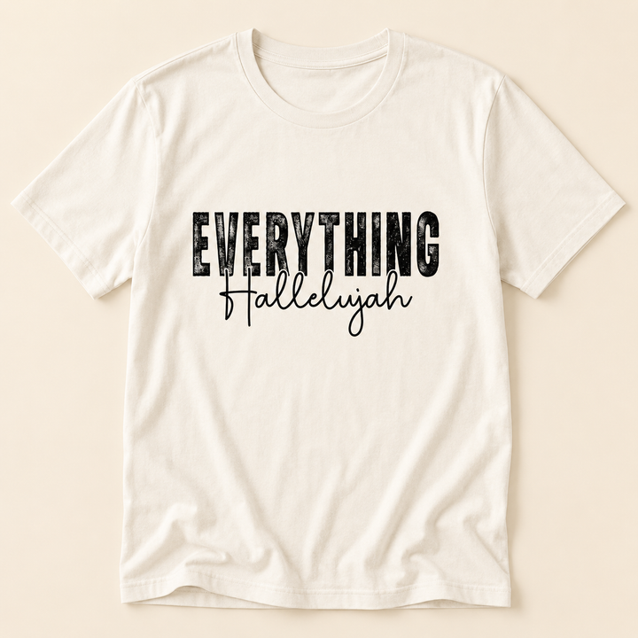 Ivory Everything Hallelujah faith graphic tee with black lettering, flat product view