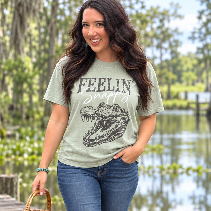 Feelin Snappy sage gator tee full-body Southern boardwalk lifestyle