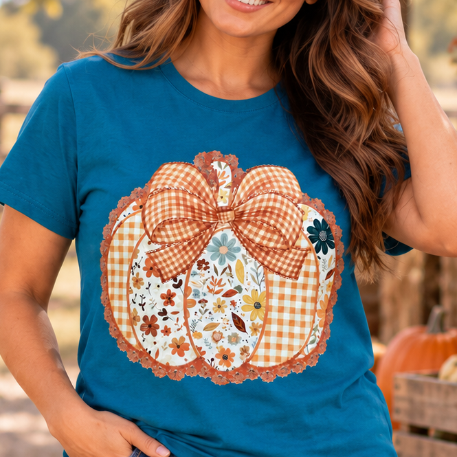 Floral Plaid Pumpkin teal graphic tee on model in a rural fall setting