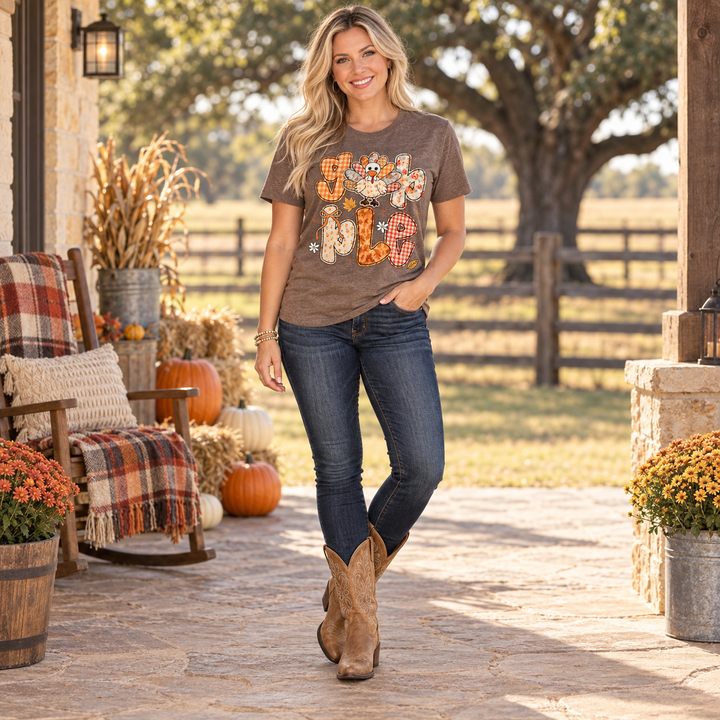 Woman wearing Gobble Patchwork Turkey brown Thanksgiving tee in a Central Texas fall setting