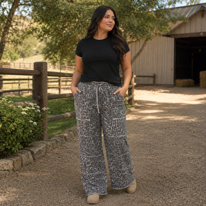 Woman wearing gray leopard wide-leg lounge pants with cargo pockets