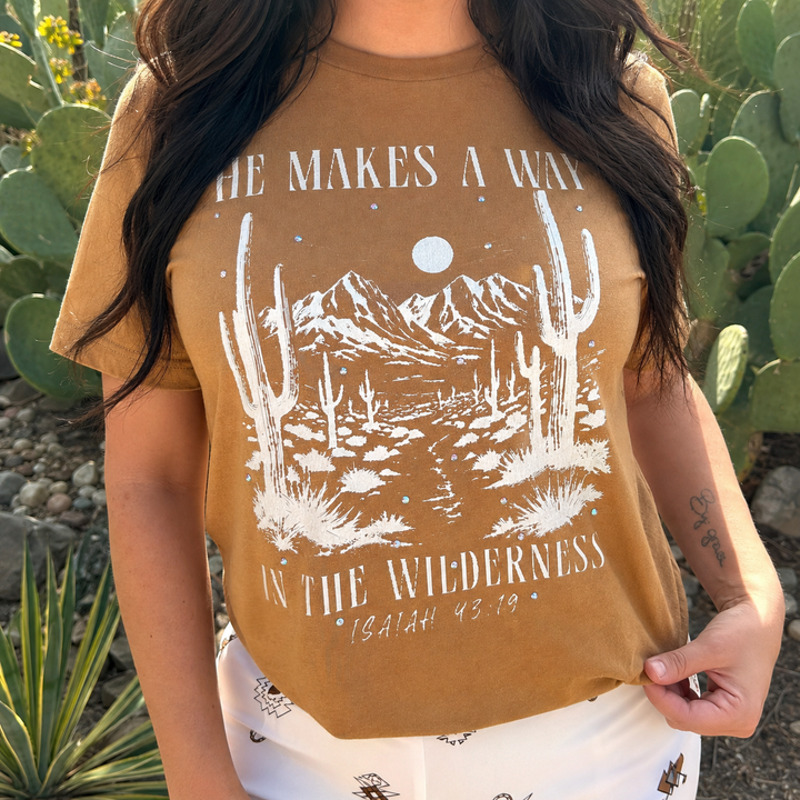 Woman wearing the heather rust He Makes a Way in the Wilderness faith tee