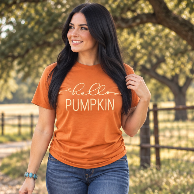 Woman carrying pumpkins in Hello Pumpkin Texas Orange fall graphic tee