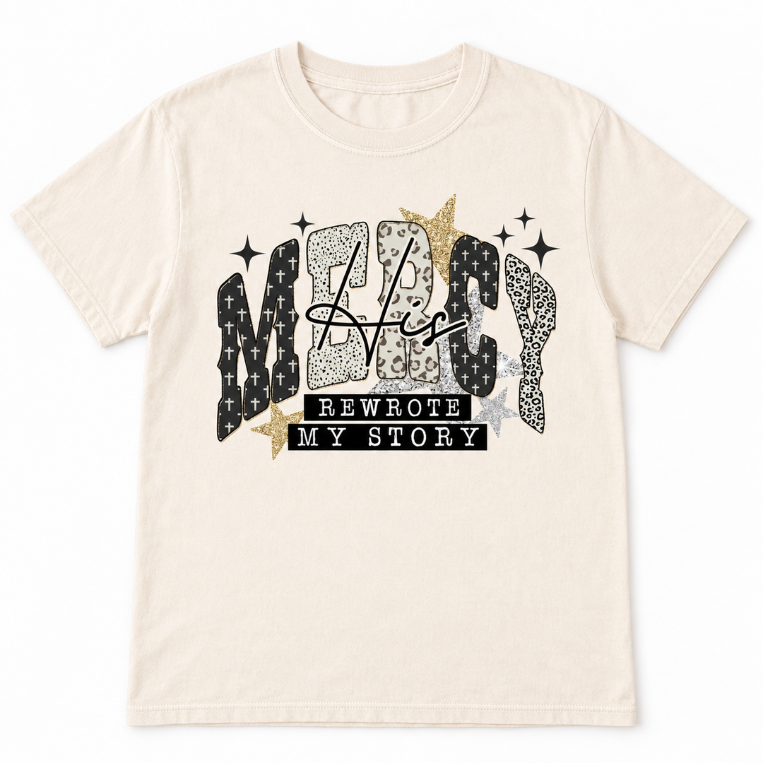 His Mercy Rewrote My Story ivory faith graphic tee, clean flat product view