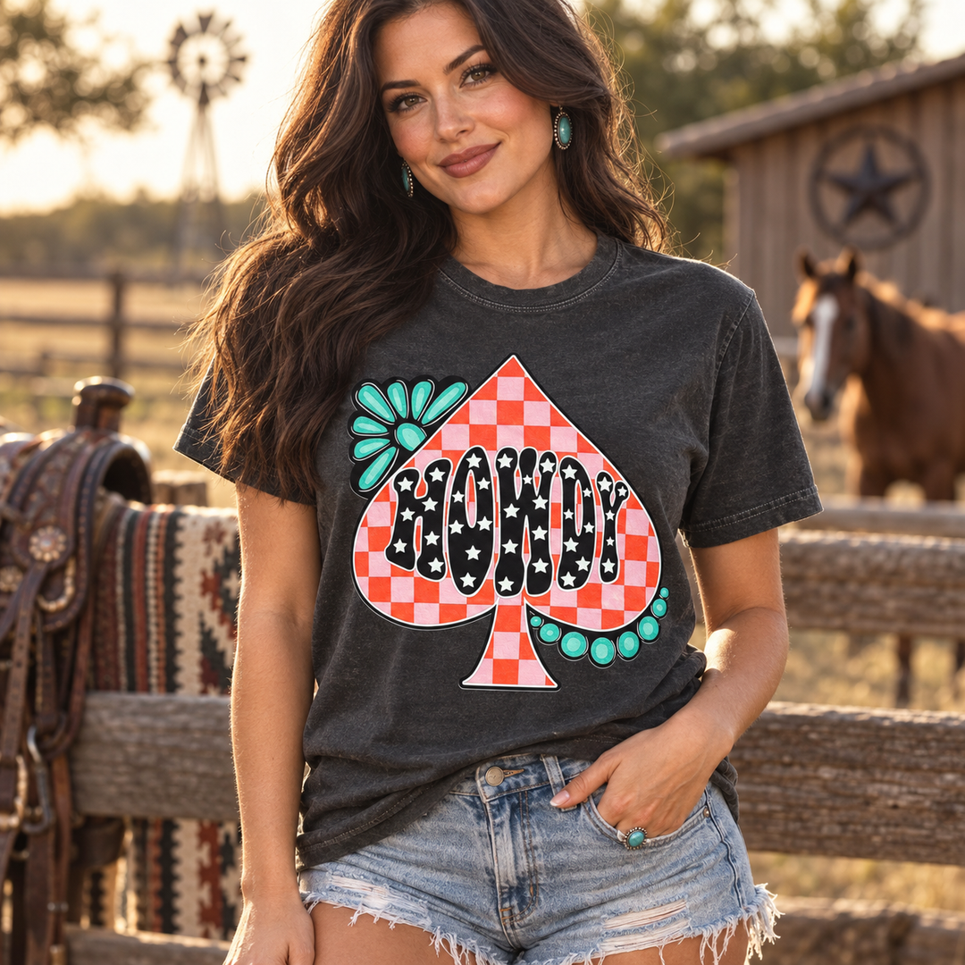 Woman wearing Howdy Checker Spade Graphic Tee in a Western ranch setting