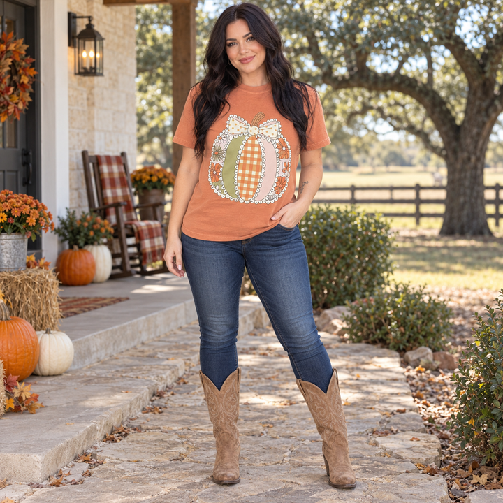 Full-body dark-haired woman wearing Lace Patchwork Pumpkin Yam fall tee in Central Texas