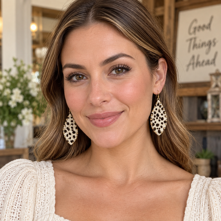 Woman wearing leopard faux fur teardrop statement earrings