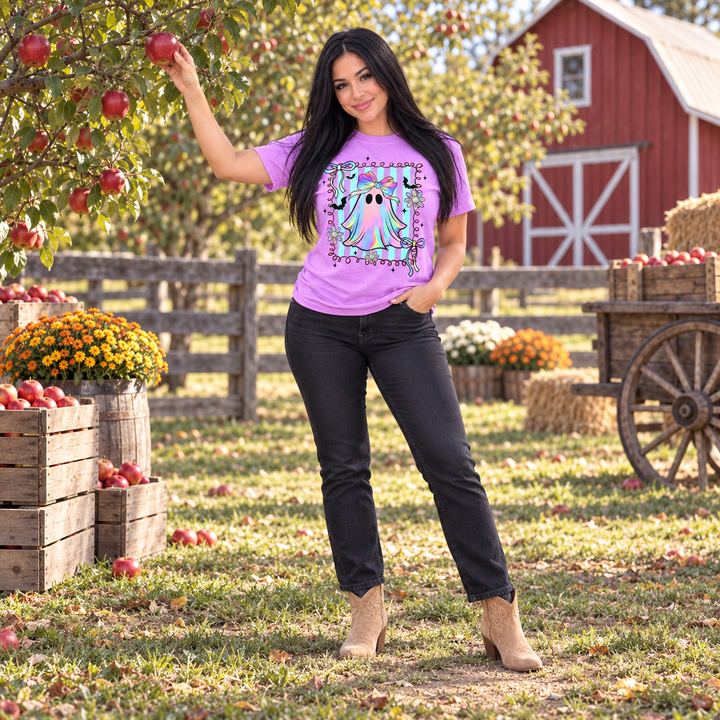 Woman wearing Neon Preppy Ghost violet graphic tee at a fall orchard
