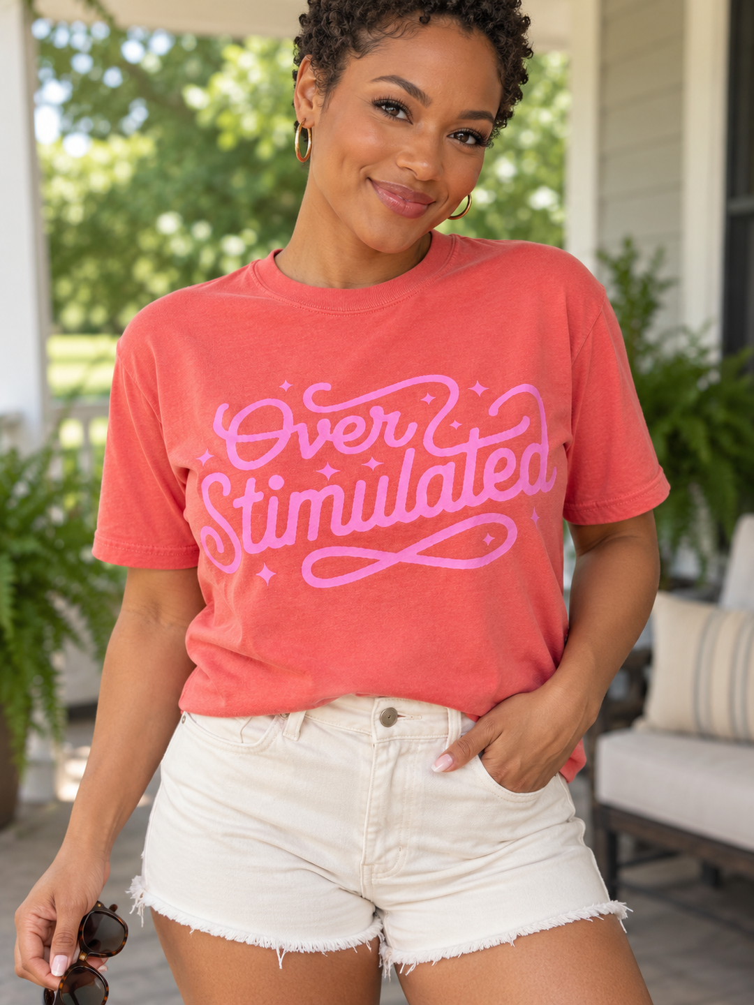 Overstimulated light salmon tee close-up model