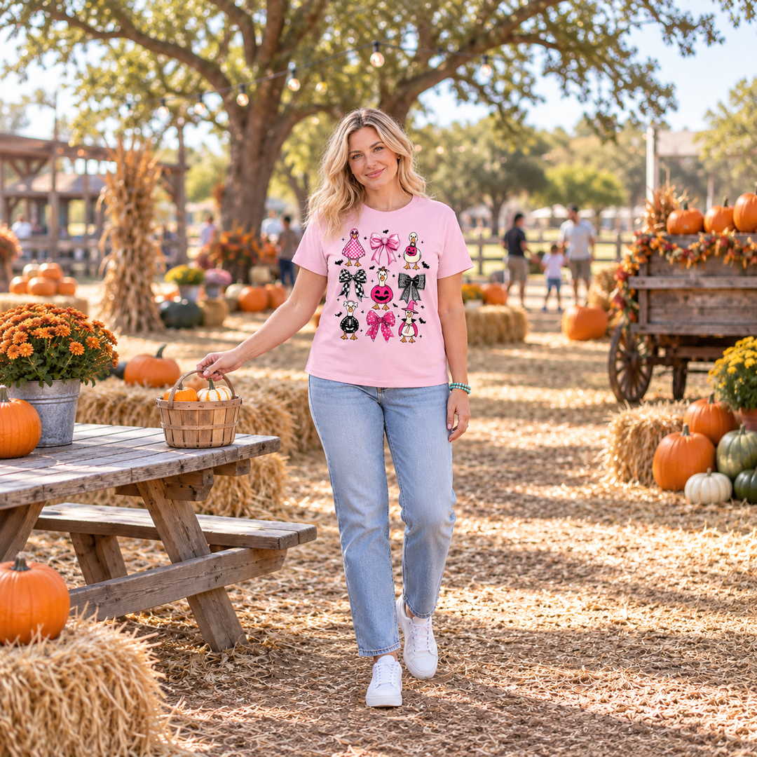 Woman wearing Pink Halloween Geese graphic tee at a Texas pumpkin patch