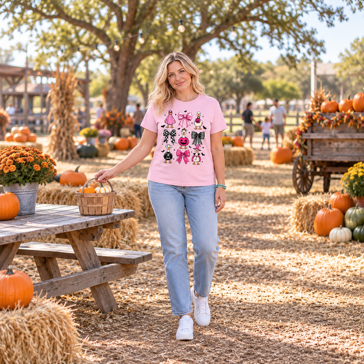 Woman wearing Pink Halloween Geese graphic tee at a Texas pumpkin patch