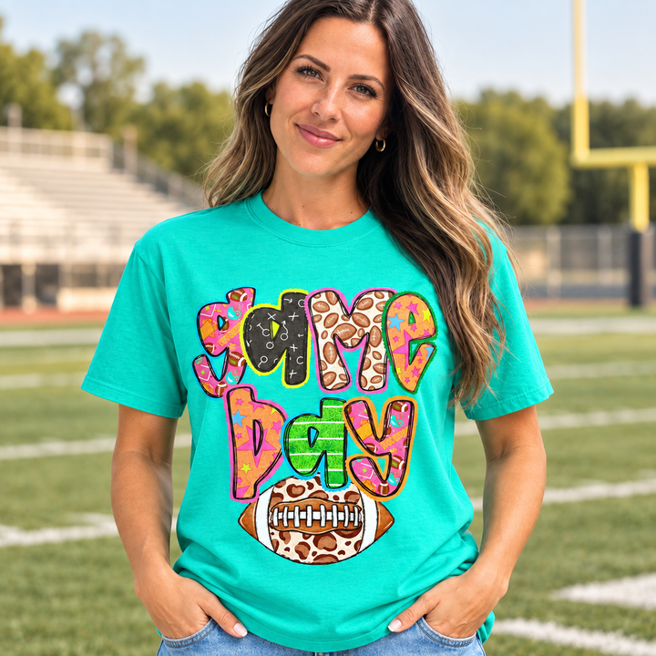 Retro Colorful Game Day graphic tee close model view at a small-town football field