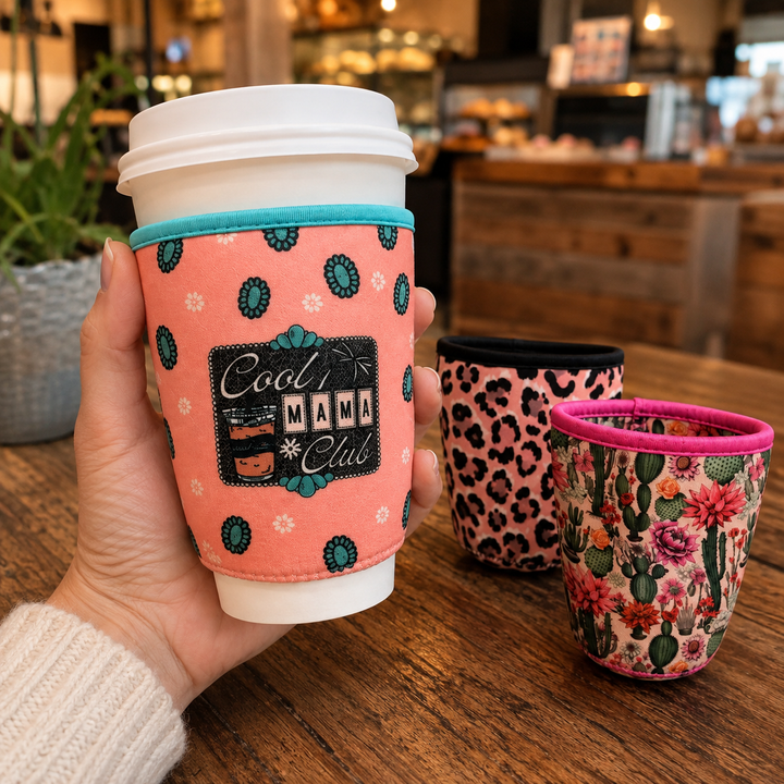 Cool Mama Club reusable cup sleeve on a coffee cup with leopard and cactus styles