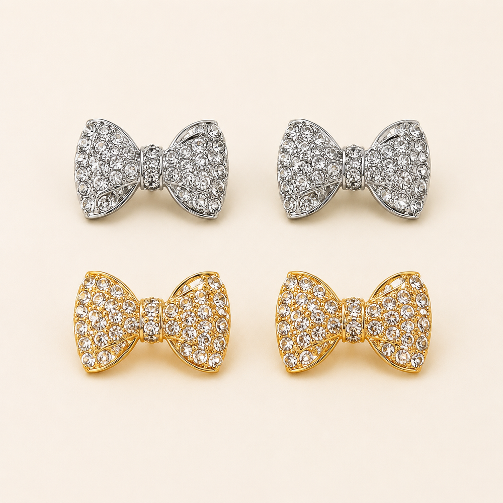 Gold-tone and silver-tone rhinestone bow stud earrings, clean product view