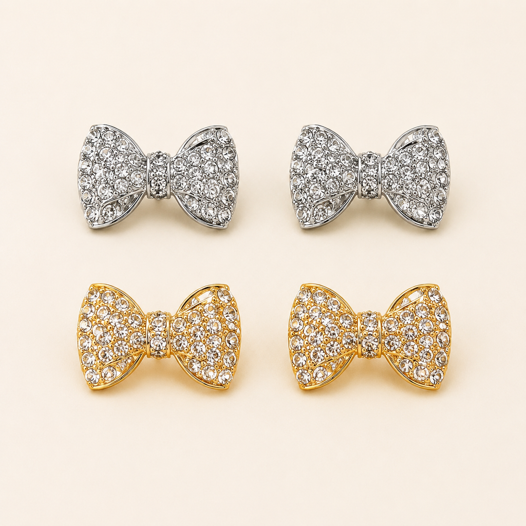 Gold-tone and silver-tone rhinestone bow stud earrings, clean product view