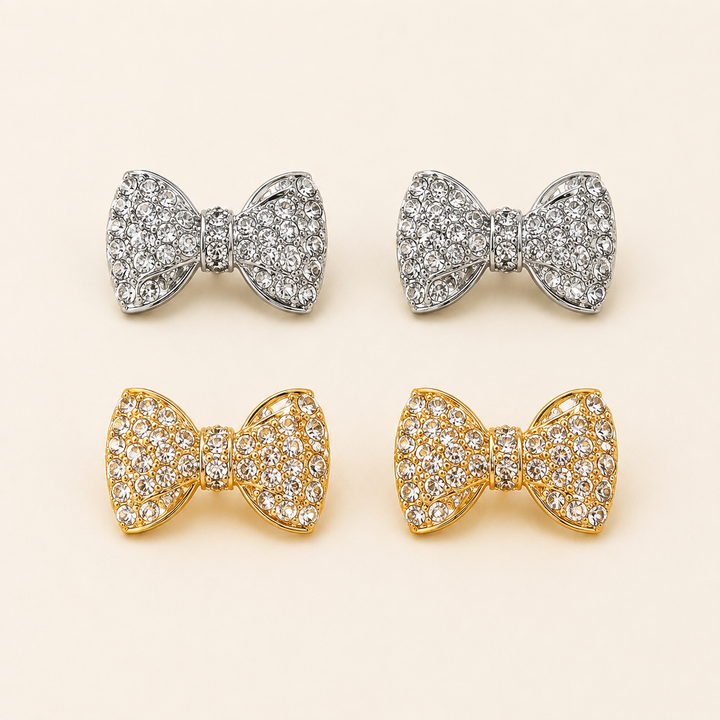 Gold-tone and silver-tone rhinestone bow stud earrings, clean product view