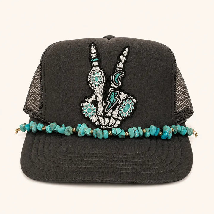 Charcoal skeleton peace sign trucker hat with turquoise-colored stone brim chain, product view