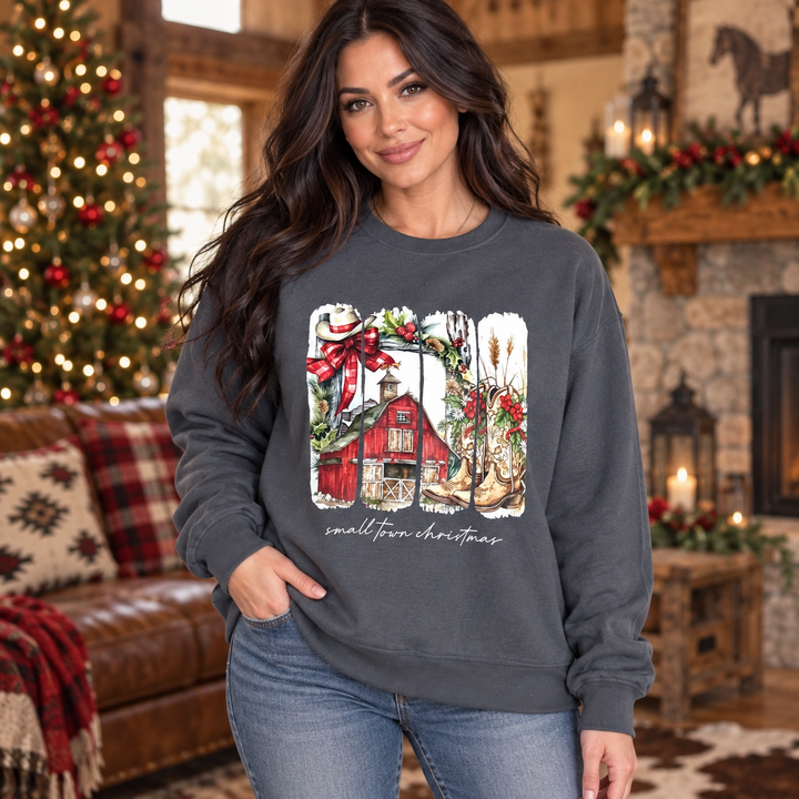 Brunette wearing the dark grey Small Town Country Christmas crewneck in a close Western portrait