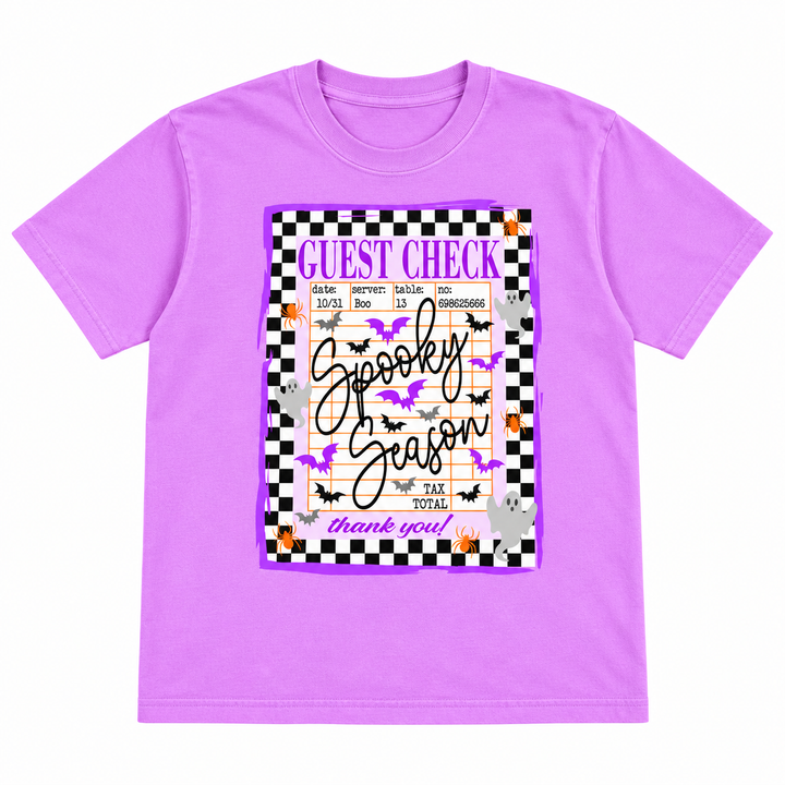 Spooky Guest Check Neon Violet Halloween Tee laid flat on pure white